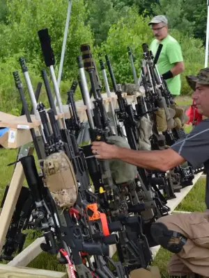 PRS Shooter Getting Rifle from rack PRS Shooter Getting Rifle from rack